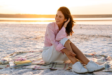 Young beautiful smiling woman relaxing