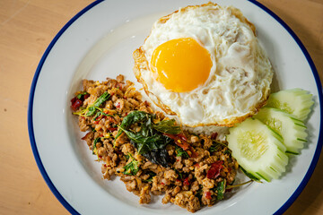 basil rice and friied egg is thai cuiisine
