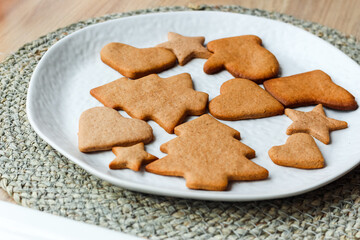Tasty homemade Christmas cookies on white plate