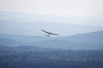 Fototapeta na wymiar Glider Plane Is Taking Off, Bezmiechowa, Bieszczady National Park,View from top, Poland