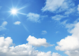 Naklejka na ściany i meble typical blue sky with sun and clouds background