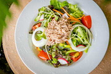 pork salad and vegetable in white dish