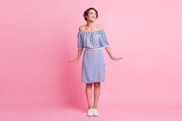 Photo portrait full body view of shy girl posing isolated on pastel pink colored background