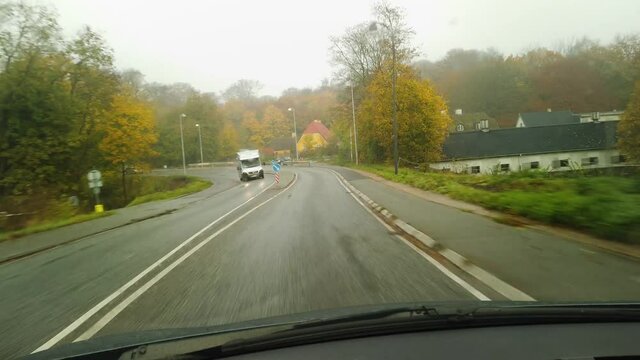 Driving on a beautiful, rainy autumn forest road, stock footage by Brian Holm Nielsen 2