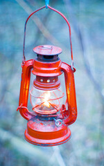 a kerosene lamp lit illuminates
