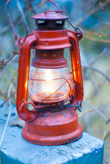 a kerosene lamp lit illuminates