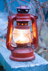 a kerosene lamp lit illuminates