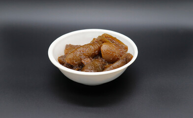 Indian tasty Lemon Pickle also known as Nimbu ka Achar, selective focus