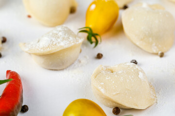 Raw dumplings, frozen homemade dumplings, on a white background.