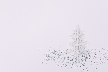 White pine tree and glitter background. White Christmas festive backdrop