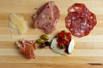 Charcuterie platter. Assortment on cured and salted deli meats and cheeses, pastrami, salami, prosciutto served with olives and dried fruits. Classic traditional party favorite.  