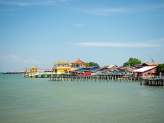 Fototapeta na wymiar George Town, Penang Island, Malaysia [ Jetty pier in waterfront wharf, life in street houses and buddhist taoist temple, ]