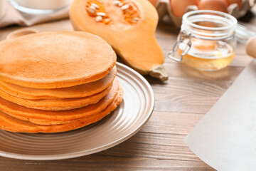 Fototapeta na wymiar Tasty pumpkin pancakes on table