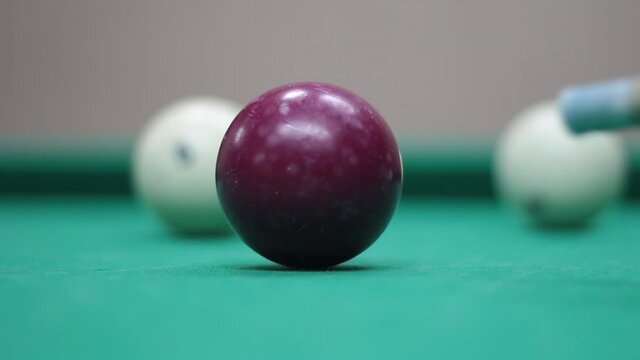 Billiard balls on the table. Game of billiards. Shooting from the table.