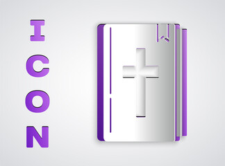 Paper cut Holy bible book icon isolated on grey background. Paper art style. Vector.