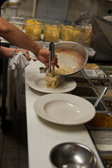 Spaghetti carbonara. Pasta with cured pork, cheese, egg, bacon, pepper and Italian parsley. Classic American or Italian restaurant favorite. Homemade pasta with butter sauce, meat and cheese.