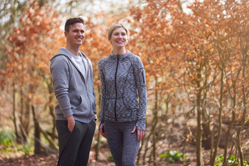 Couple Exercising In Autumn Countryside During Covid 19 Lockdown