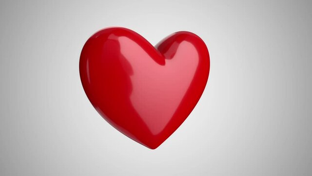 Animation rotation of a big red heart on a light background. Valentine's Day