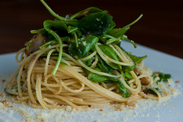 Pesto Pasta with jumbo shrimp and pesto sauce (extra virgin olive oil, pine nuts and basil), mixed with fresh chopped asparagus and halved cherry tomatoes served over homemade pasta & seasoned w/ s&p.