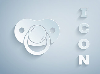 Paper cut Baby dummy pacifier icon isolated on grey background. Toy of a child. Paper art style. Vector.