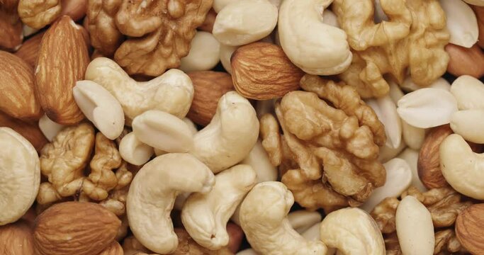 Smooth Camera Movement Over a Handful Mix of Nuts. Top View. Healthy Food. Close-Up