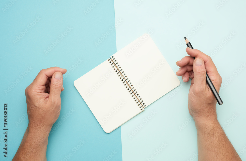 Poster two male hands holding open notepad with empty white sheets