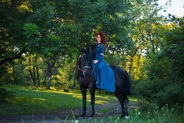 cosplay Braveheart red curly girl with a horse in the woods