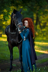 cosplay Braveheart red curly girl with a horse in the woods