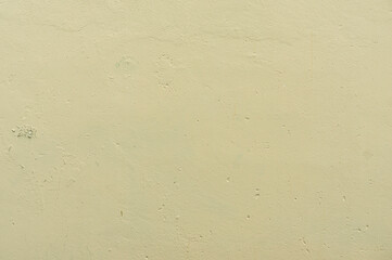 wall texture with faded and damaged green paint