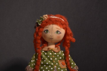 
Handmade doll on a dark background
