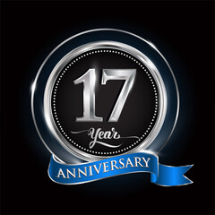 Celebrating 17th years anniversary logo. with silver ring and blue ribbon.