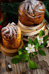 Easter cake kraffin. Kraffins with raisins, candied fruits and poppy seeds, sprinkled with powdered sugar. Close-up of homemade cake. Cruffin. Food.