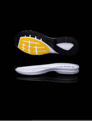 Obraz premium white shoe sole. Isolated on a black background.