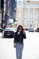 young pretty asian girl outside on big city street, lifestyle people concept