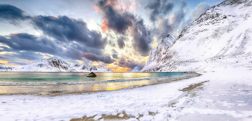 Splendid winter scenery with Haukland beach during sunset and snowy  mountain peaks near Leknes.