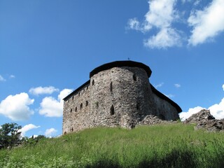 Fototapeta na wymiar The ruins of medieval Raseborg castle on a perfect summer day. The photo is taken in Finland.