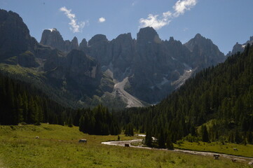 Hiking in the lush and dramatically beautiful Val di Fiemme and Passo Rollo in the Dolomites,...