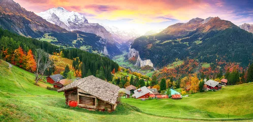 Fototapeten Scenic autumn view of picturesque alpine Wengen village and Lauterbrunnen Valley © pilat666