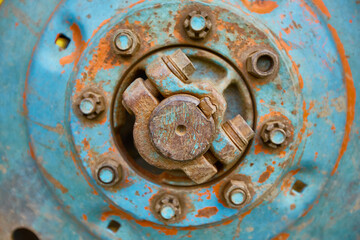 old rusty tractor wheel close up