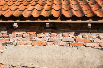 Brick wall with tile roof