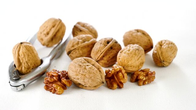 walnut and nutcracker on white background