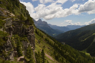 Fototapeta na wymiar Hiking and climbing in the stunning valleys and mountains of Val di Fiemme in the Dolomites, Italy