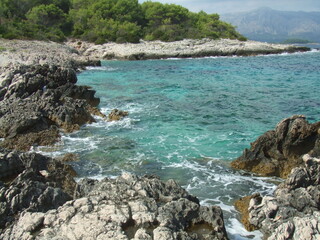Fototapeta na wymiar The beautiful Adriatic Sea surrounded by the Dalmatian Mountains, in Korcula, Croatia.