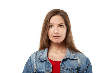 The face of a surprised young blonde woman, looking at the camera. White isolated background. Strong surprise.