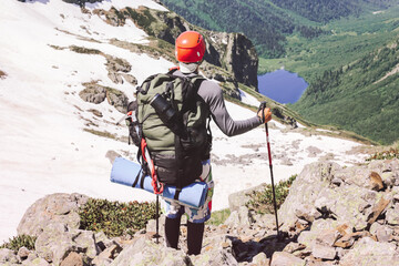 Man traveling with backpack hiking in mountains Travel Lifestyle
