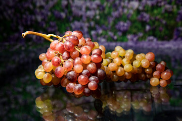 still life with golden grapes on a table on a dark background