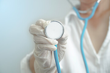 woman doctor with a stethoscope in the hands.