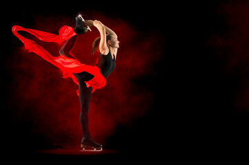 Biellmann spin. Woman figure skating in action. Sports banner © Andrey Burmakin