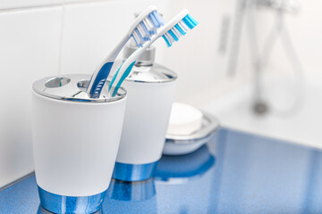 Liquid and ordinary soap in the bathroom. Cleanliness of hands and body.