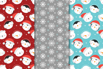 Set of Christmas seamless patterns with snowmen, penguins and snowflakes. © Елена Хмельнюк